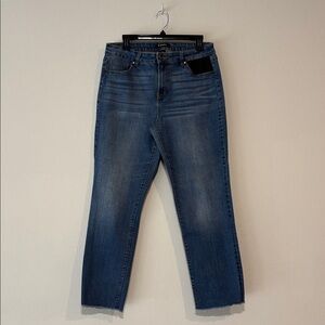Medium wash jeans with one flannel accent pocket